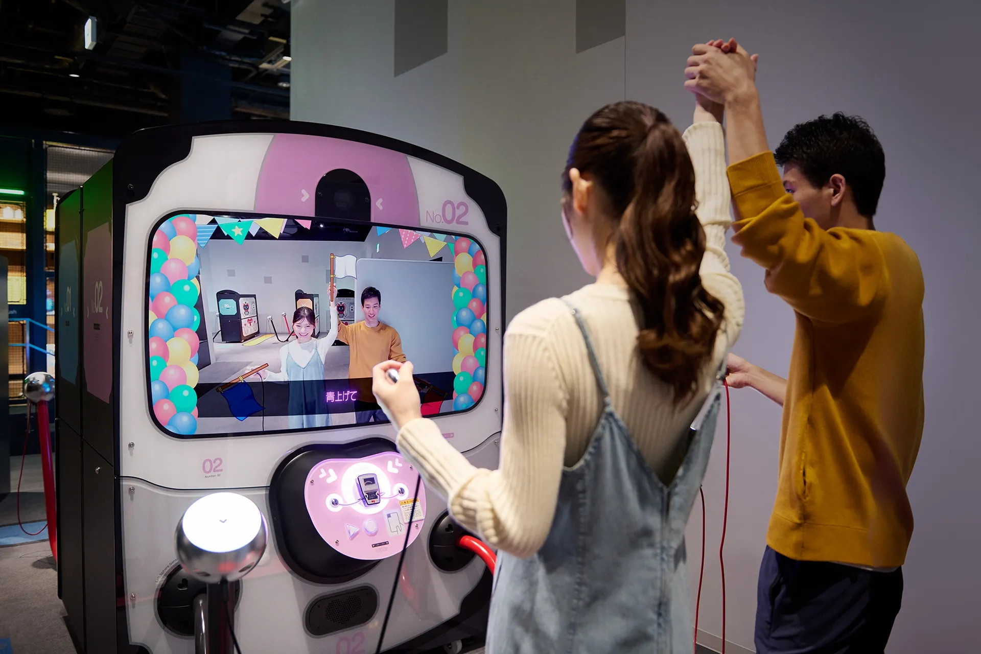 Two people playing Love Tester SP in Nintendo Museum