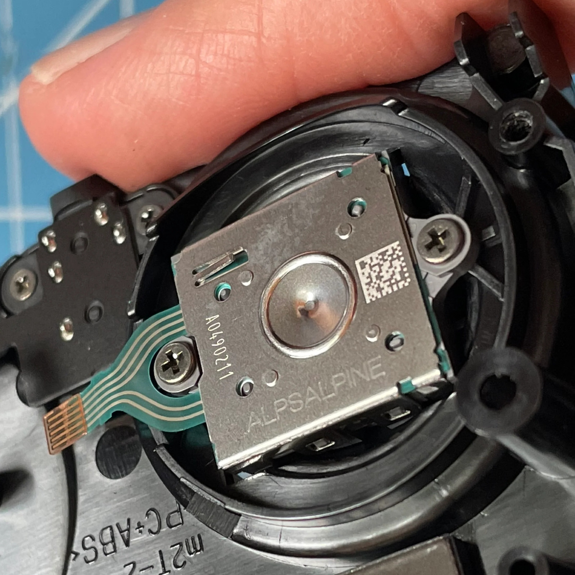 Closeup photo of Pro Con 2 analog stick; it’s screw-mounted from the bottom side