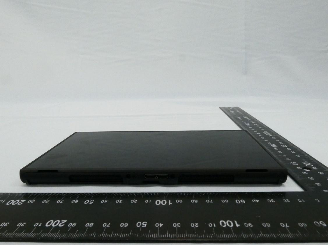 Photo from NCC test report:
Bottom side of BEE-056 console, featuring a proprietary connector