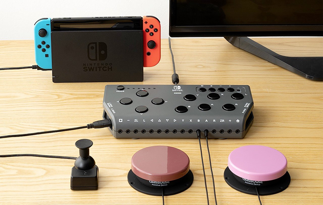 Photo of Hori Flex Controller for Nintendo Switch, being connected to a docked Switch, an external joystick, and two external buttons