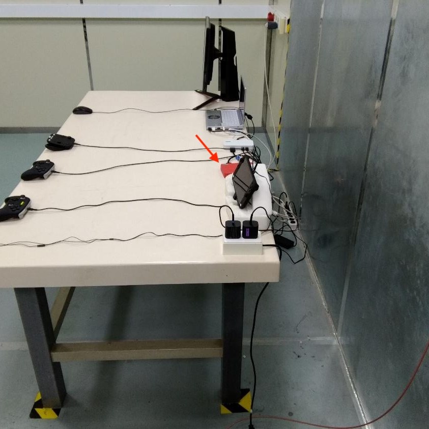 Photo from NCC’s test report for Switch 2 dev kit BEE-O56, showing a mysterious red box amid the test setup