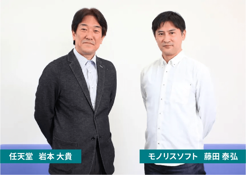 Photo of Iwamoto and Fujita standing next to each other