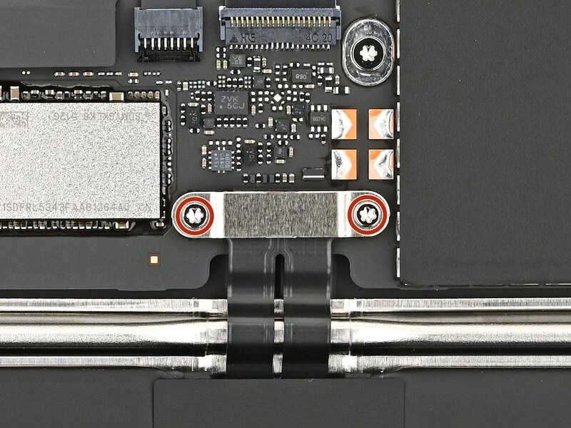 Photo of MacBook Neo battery connector with 2 screws