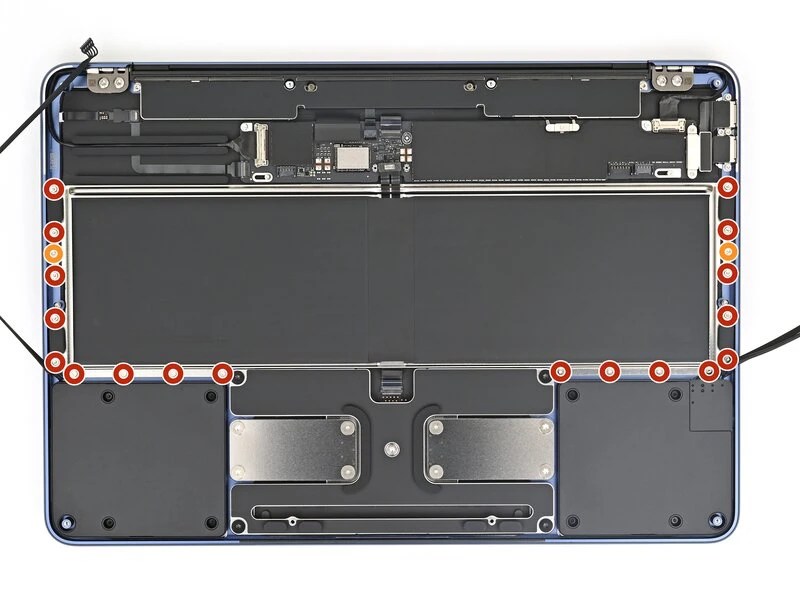 Photo of MacBook Neo battery, showing 18 screws around it