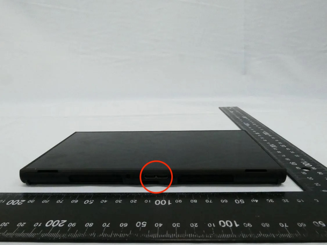 Photo from NCC test report:
Bottom side of BEE-056 console, featuring a proprietary connector