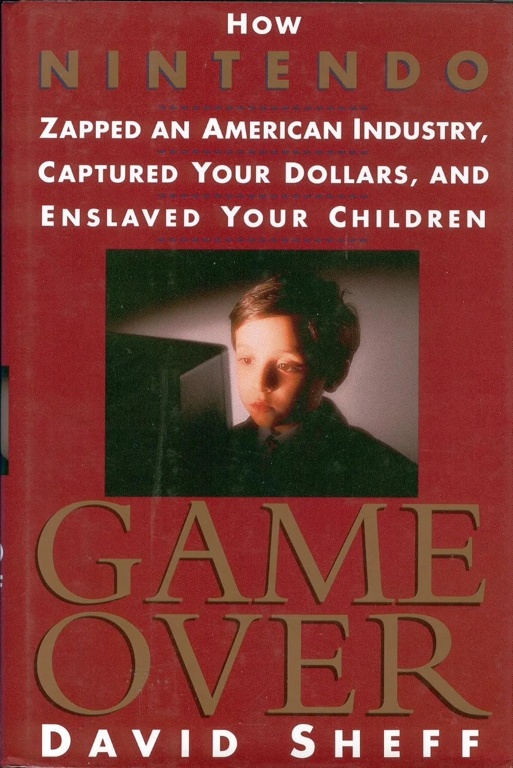 Book cover of “Game Over: How Nintendo Zapped an American Industry, Captured Your Dollars, and Enslaved Your Children” by David Sheff; it features a photo of a young boy emotionlessly staring at a TV only inches away from his face